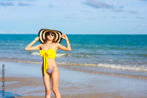 Sexy woman wear swimsuite on the beach. summer holiday concept