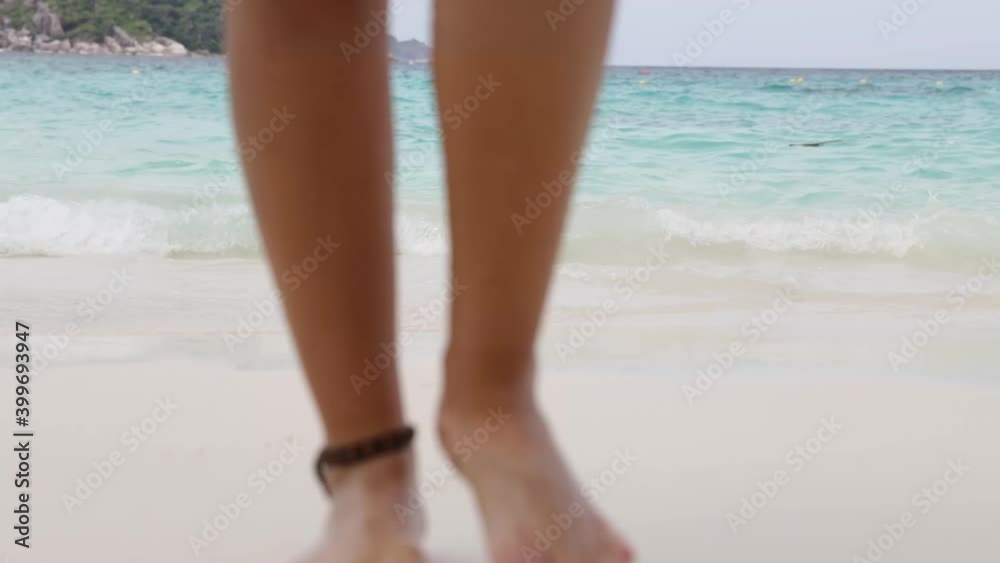 Portrait young woman legs feet walking on sandy beach , concept vacation travel in summer Portrait young woman legs feet walking on sandy beach , concept vacation travel in summer