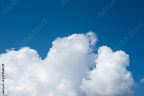 Fluffy white cloud float on bright blue sky natural scene background in winter weather for freedom, peaceful, light and fresh human mind meaning when look at it