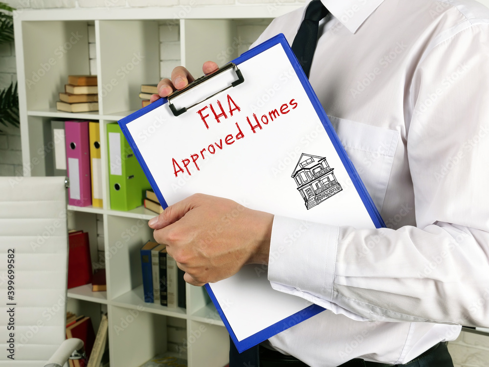  Financial concept meaning Federal Housing Administration FHA Approved Homes with phrase on the sheet.