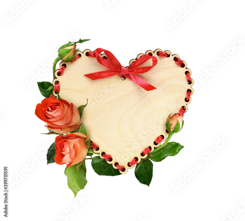 Wooden heart with red ribbo...