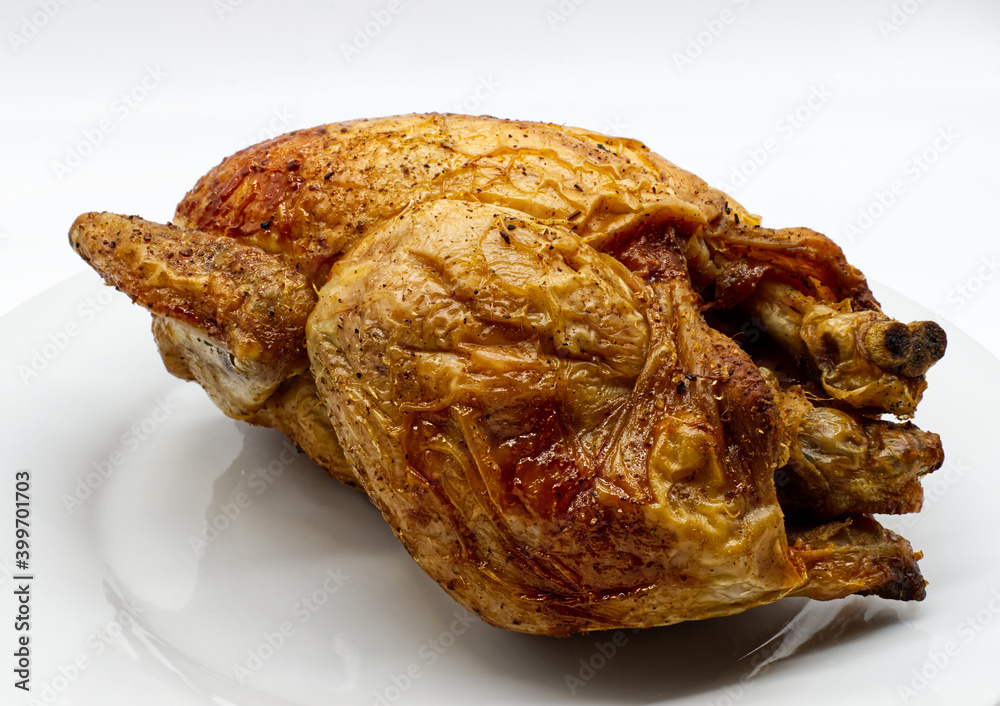 Whole roasted chicken isolated on white background
Whole roasted chicken isolated on white background