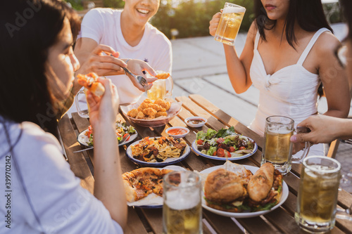Canvas Print Group holiday party of asian people Eating dinner and drinking beer at home