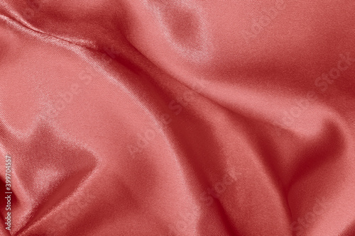 Rose gold fabric cloth texture for background and design art work, beautiful crumpled pattern of silk or linen.
