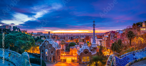 Sunrise in Barcelona seen from Park Guell. Park was built from 1900 to 1914 and was officially opened as a public park in 1926. In 1984, UNESCO declared the park a World Heritage Site photo