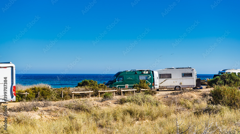 Camper car on beach, camping on seashore Camper car on beach, camping on seashore