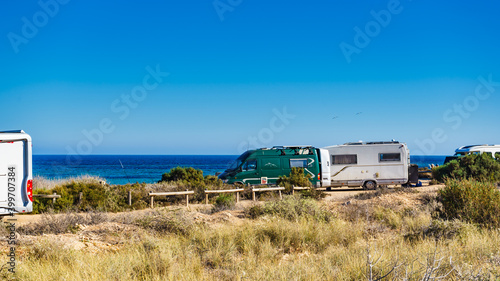 Camper car on beach, camping on seashore © anetlanda