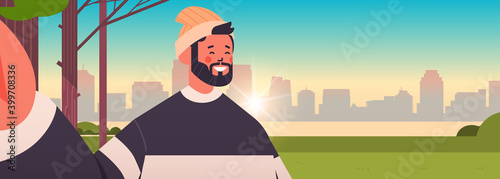 happy man taking selfie on smartphone camera guy making self photo in urban park cityscape background horizontal portrait vector illustration