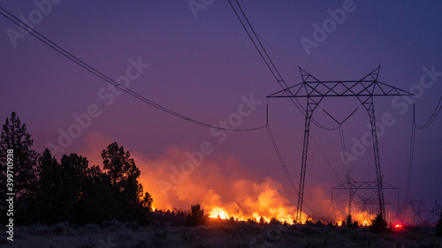 California wildfire burns under power lines  photo