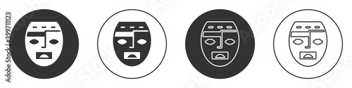Black Mexican mayan or aztec mask icon isolated on white background. Circle button. Vector.