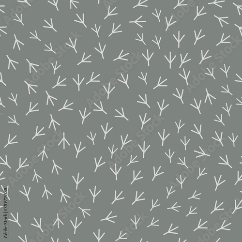 Seamless abstract pattern with bird trail. Vector illustration. Light Bird footprints track on grey