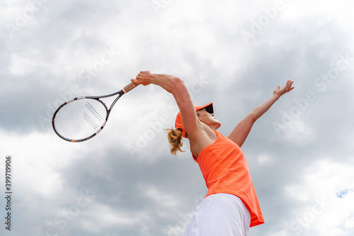 tennis serve by a young woman in a tournament © edojob