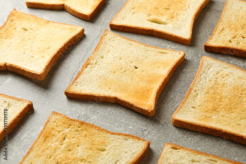 Flat lay with toast breads on gray background