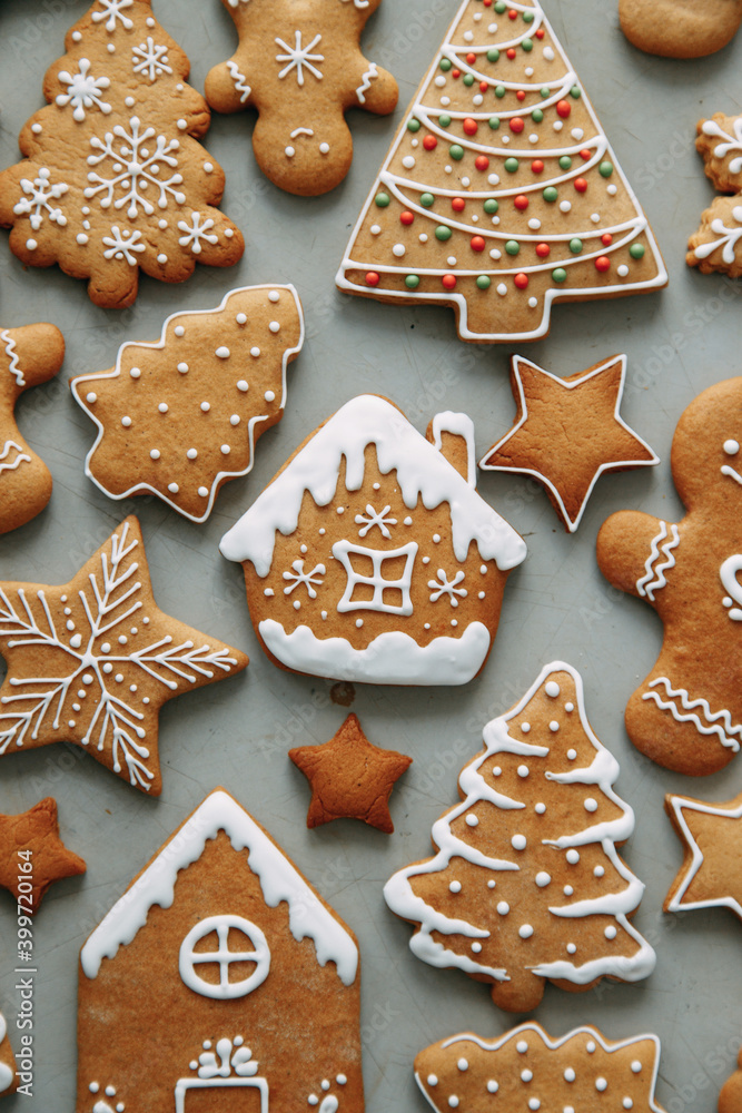 Winter holiday pattern-a set of gingerbread, the layout of the pattern. cookies in the form of a house, a christmas tree, a person, a star decorated with icing. Winter holiday pattern-a set of gingerbread, the layout of the pattern. cookies in the form of a house, a christmas tree, a person, a star decorated with icing.
