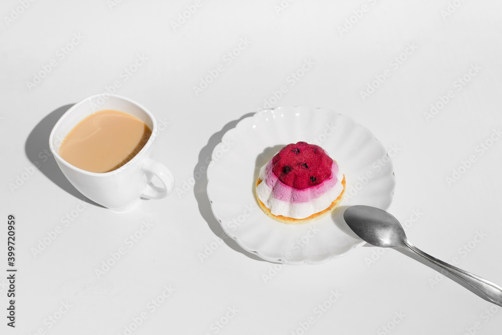 Cup of tea and cake with blueberries, white table background. Morning breakfast with dessert in the kitchen. Cup of tea and cake with blueberries, white table background. Morning breakfast with dessert in the kitchen.
