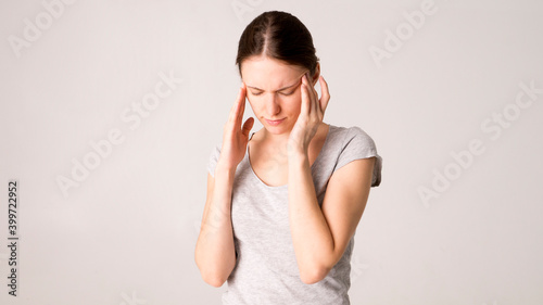 Young beautiful woman has headache