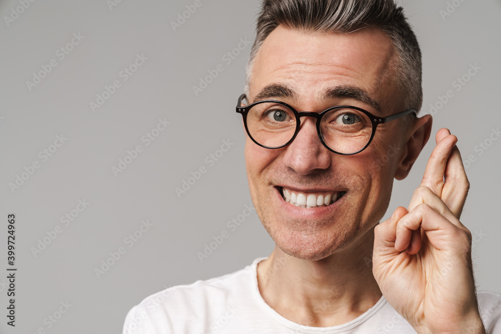 Worried casual man making a wish isolated Worried casual man making a wish isolated