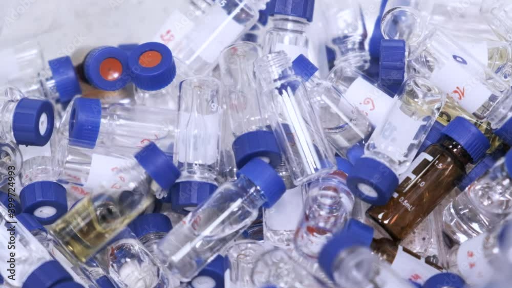 Falling down HPLC glass vials with blue caps after analysis. Wrong tests of vaccine against coronavirus. 
