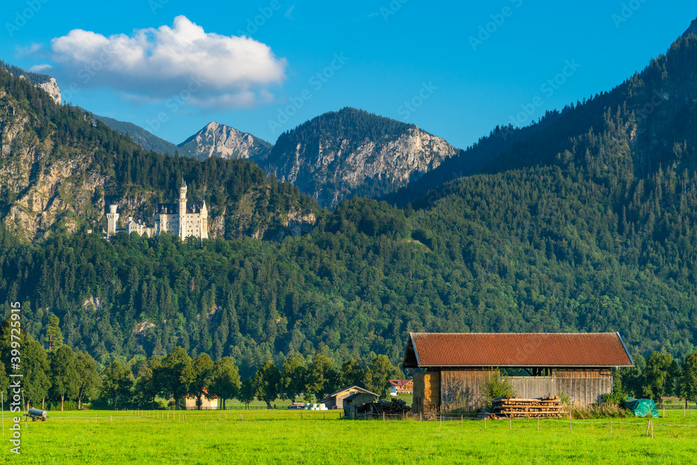 Scenic view of Schwangau with Neuschwanstein Castle and Tegelberg mountain peak . Allgäu region of Bavaria in Germany