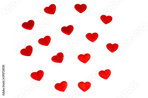 Red hearts - valentines are laid out in the form of a circle on a white background