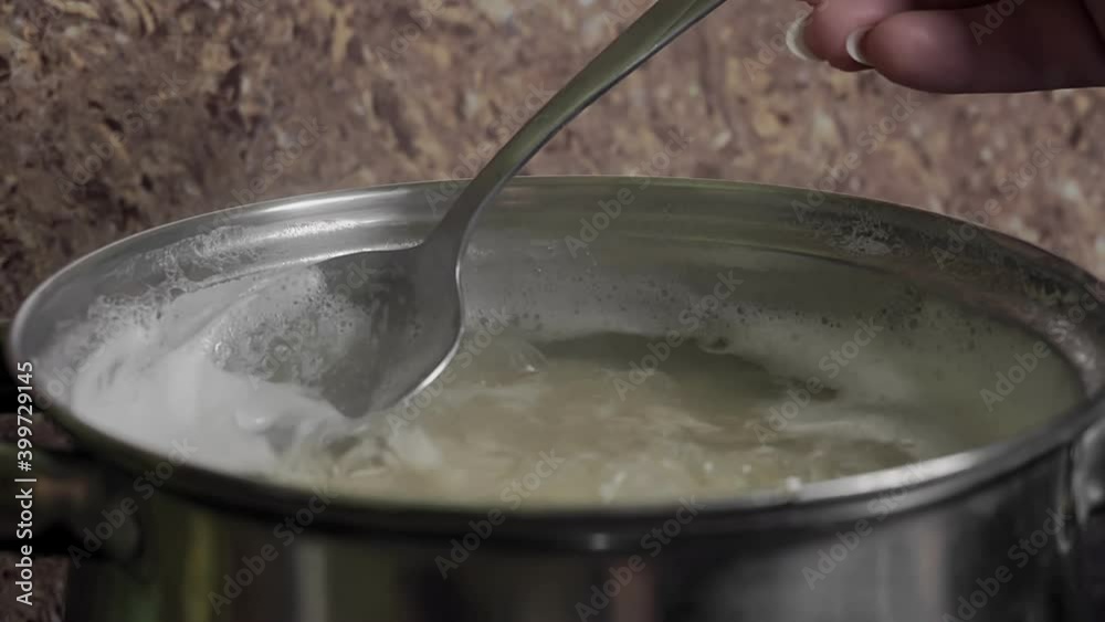 Beans Cooking Process White bean seeds in boiling water in a saucepan. High quality 4k footage Beans Cooking Process White bean seeds in boiling water in a saucepan. High quality 4k footage
