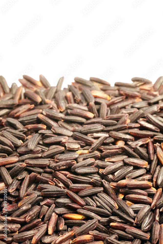 Close up of black rice on white background, selective focus. Close up of black rice on white background, selective focus.