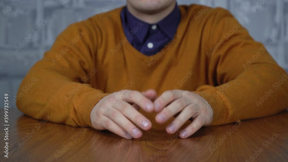 the man knocks his fingers on the table the man knocks his fingers on the table