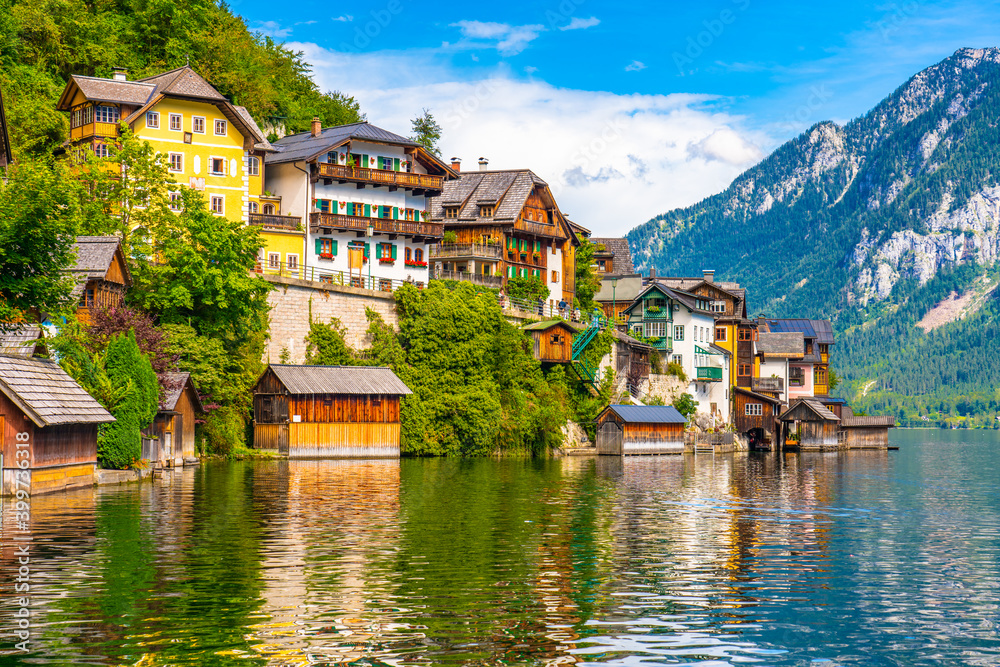 Scenic view of famous Hallstatt mountain village in the Austrian Alps at beautiful light in summer, Salzkammergut region, Hallstatt, Austria Scenic view of famous Hallstatt mountain village in the Austrian Alps at beautiful light in summer, Salzkammergut region, Hallstatt, Austria