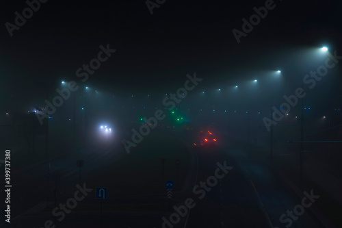 Night city road in the fog.