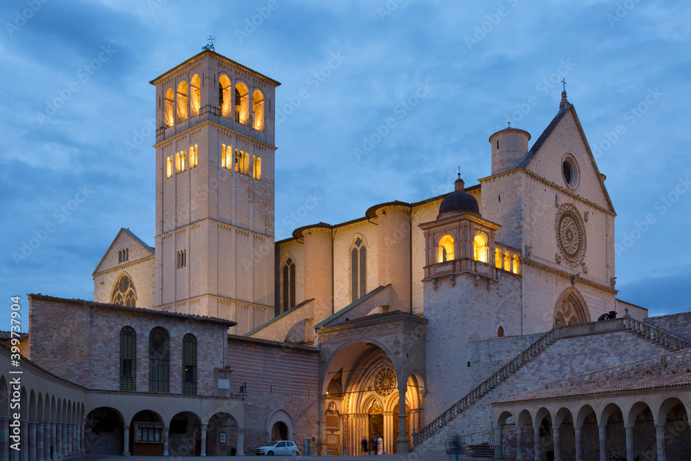 Famous Basilica of Saint Francis of Assisi with Lower Plaza in night. Assisi, Umbria, Italy