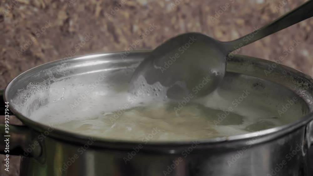 Beans Cooking Process White bean seeds in boiling water in a saucepan. High quality 4k footage Beans Cooking Process White bean seeds in boiling water in a saucepan. High quality 4k footage
