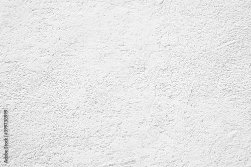White cement texture stone concrete,rock plastered stucco wall; painted flat fade pastel background white grey solid floor grain. Rough top white
