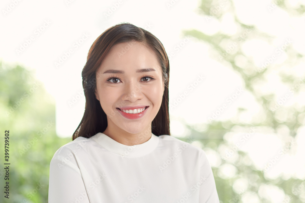 Young beautiful Asian business woman standing in office. Young beautiful Asian business woman standing in office.