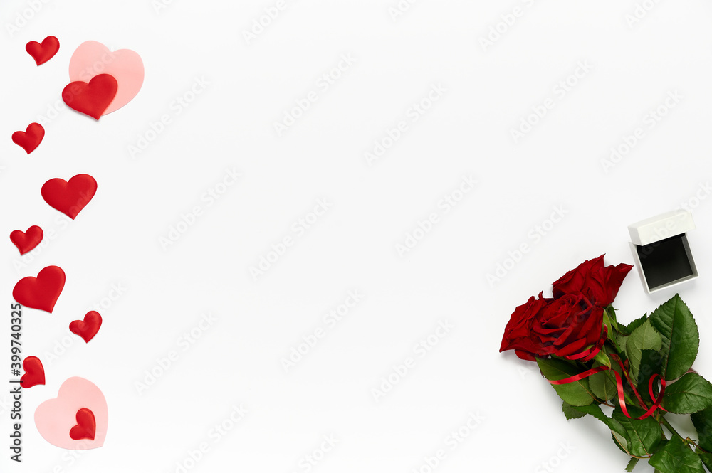 Bouquet of roses, many hearts and box for ring on white background. Top view, flat lay