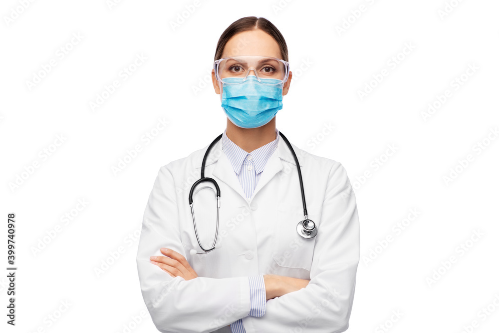 health, medicine and pandemic concept - young female doctor with stethoscope wearing goggles and face protective medical mask for protection from virus disease