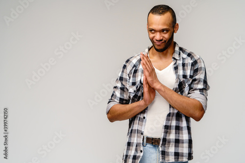 Cuadro en lienzo Closeup portrait of happy young handsome african-american man rubbing hands toge