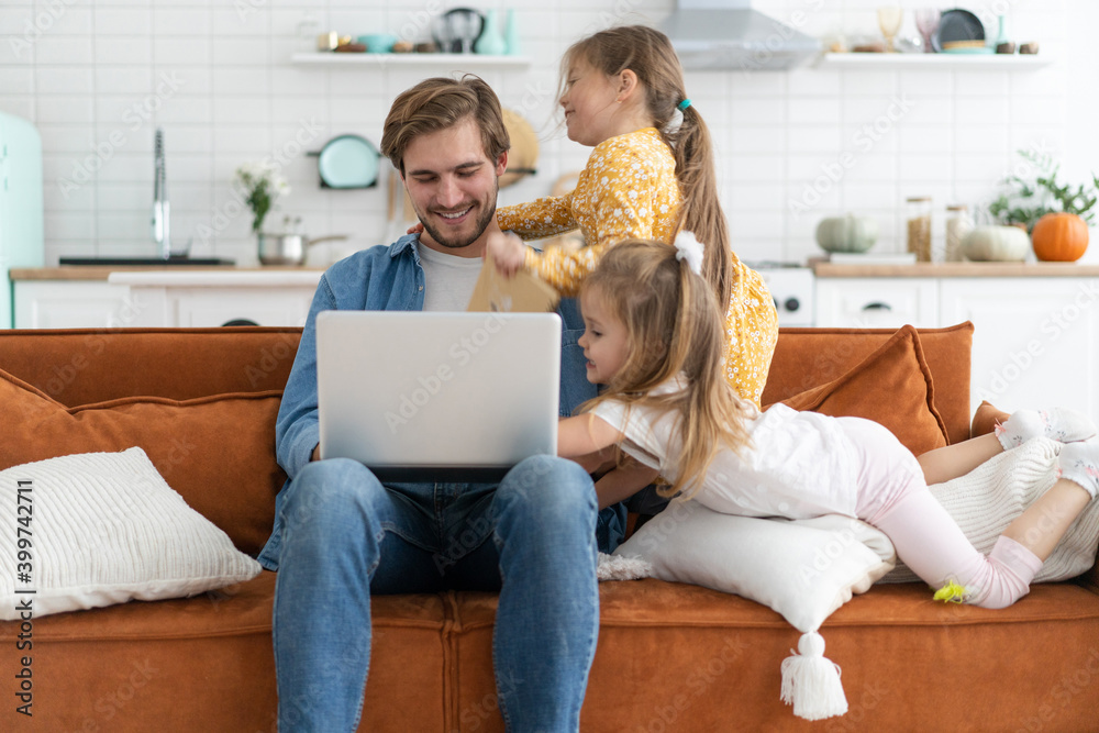 Father working from home with children. Homeschooling, stay home, social distancing during coronavirus quarantine