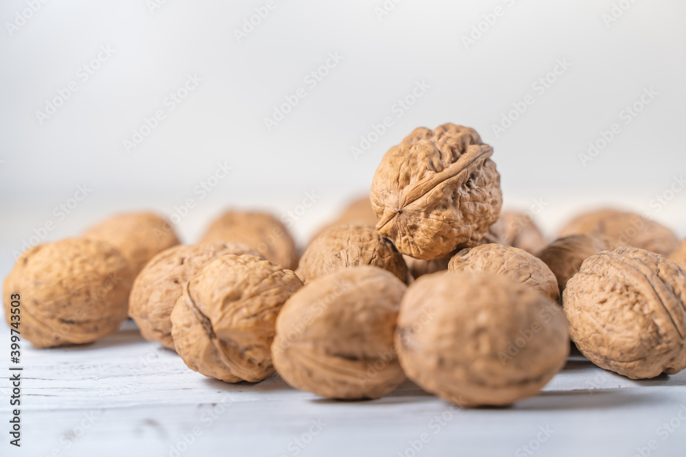 Walnuts kernels on white wooden desk, stock photo Walnuts kernels on white wooden desk, stock photo