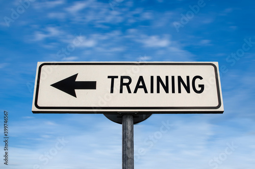 Training road sign, arrow on blue sky background. One way blank road sign with copy space. Arrow on a pole pointing in one direction.