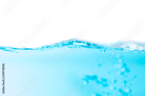 Wavy motion on surface of water and bubbles created by the movement.