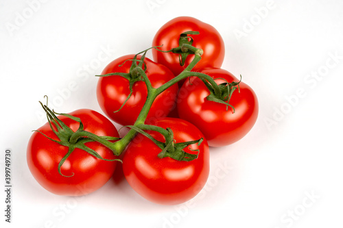 a bunch of large tomatoes on a white background © Вячеслав 