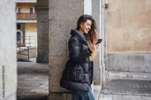 Girl watching a phone on street