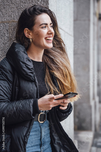 Girl watching a phone on street