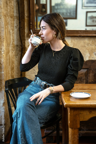 girl in a coffee shop smiling