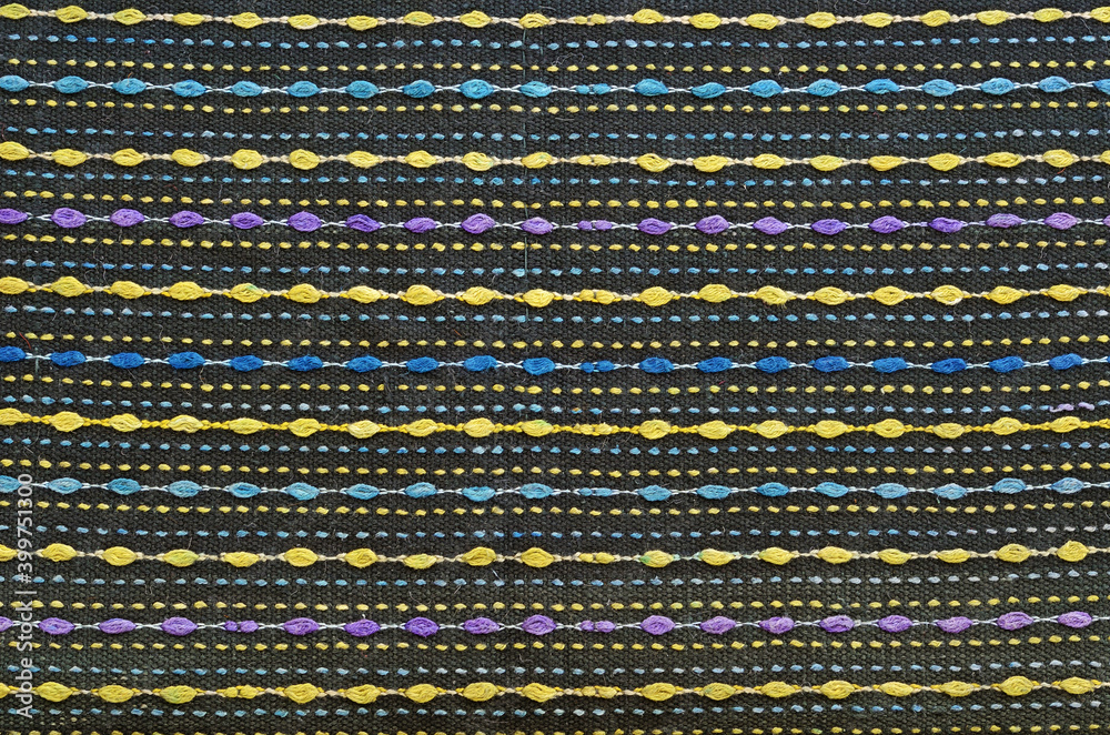 Multicolored canvas wool dark fabriс background Multicolored canvas wool dark fabriс background