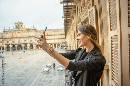 Girl taking a selfie with her phone