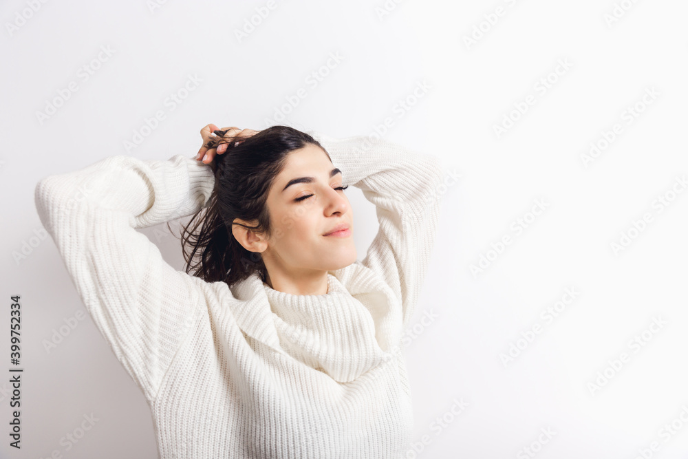 Snowly. Portrait of beautiful brunette woman in comfortable soft longsleeve isolated on white studio background. Home comfort, emotions, facial expression, winter mood concept. Copyspace. Snowly. Portrait of beautiful brunette woman in comfortable soft longsleeve isolated on white studio background. Home comfort, emotions, facial expression, winter mood concept. Copyspace.