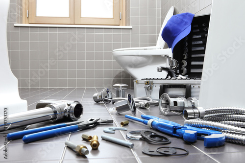 Fotografie plumber tools and equipment in a bathroom, plumbing repair service, assemble and