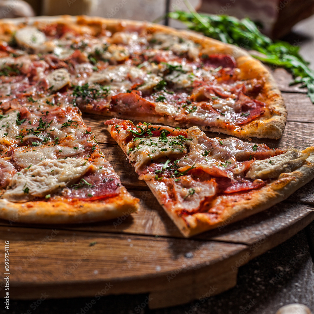 Italian pizza on wooden board Italian pizza on wooden board