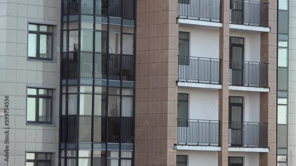 Panoramic video of a residential apartment building with balconies and glazing Panoramic video of a residential apartment building with balconies and glazing